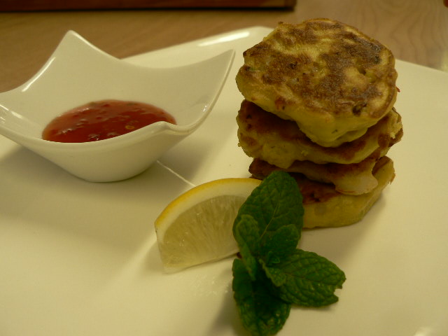 Corn and Kumara Brunch Fritters served with grilled bacon and tomatoes